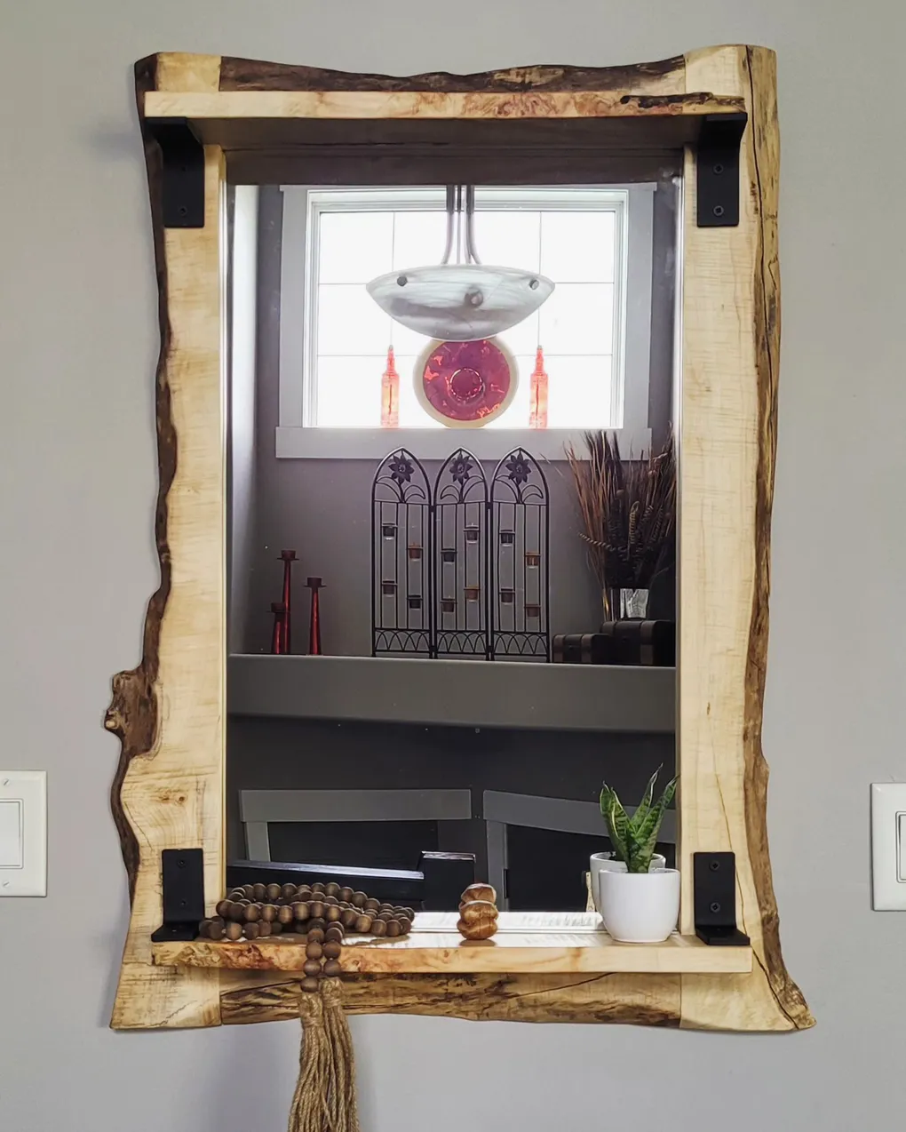 Live edge framed mirror on a wall