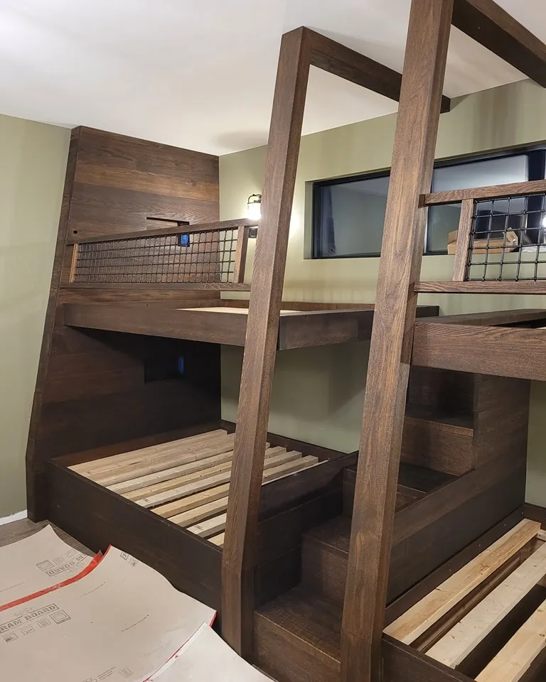 Built-in bunk bed with a stair unit and handrail